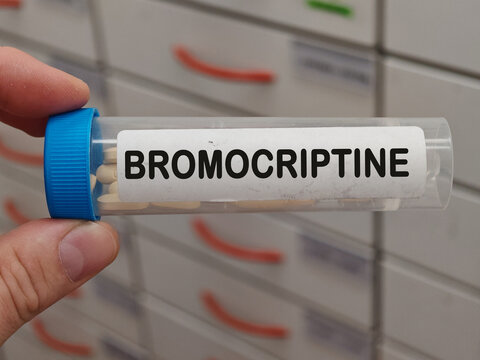 Box of BROMOCRIPTINE tablets on a hospital pharmacy table used to treat Parkinson disease and high prolactin a dopamine agonist.