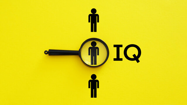 IQ Assessment and Talent Identification Concept with Magnifying Glass Highlighting Individual Among People Symbols on Yellow Background Intelligence Testing Human Potential and Recruitment