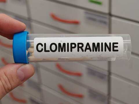 Transparent plastic Box of CLOMIPRAMINE tablets on a hospital pharmacy table used to treat depression and obsessive compulsive disorder a tricyclic antidepressant.