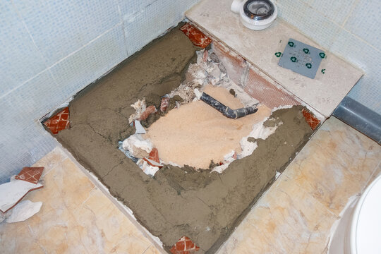 Bathroom Renovation with Shower Tray Removed and Plumbing Exposed