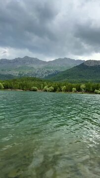 Picturesque Nature Timelapse: Rippling Pond, Fishing, and Forest Landscape