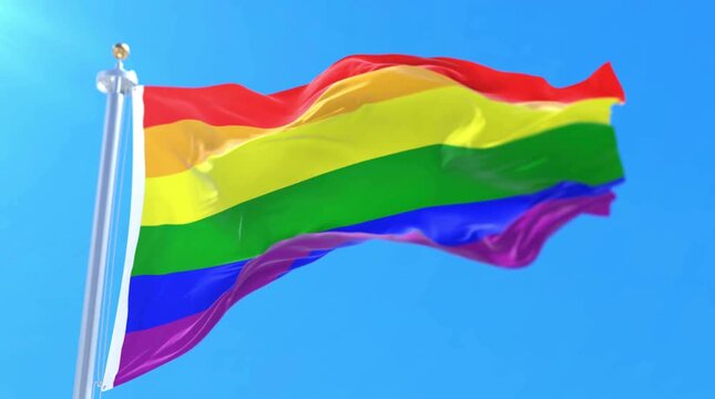 Colorful Rainbow Flag Waving in Bright Blue Sky with Gentle Wind Movement
