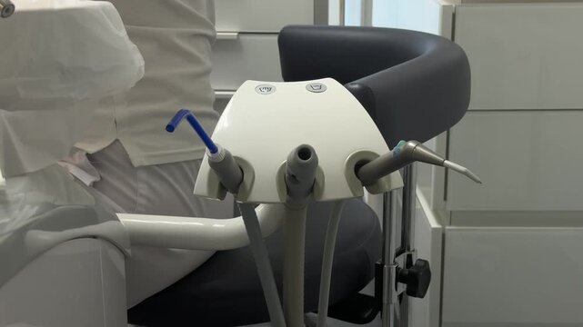 Complete dental filling procedure with patient dentist microscope anesthesia rubber dam and modern restorative treatment set. professional dental care.