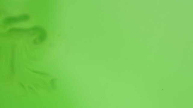 Bright green solid color background for chroma key editing and visual effects production.