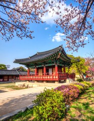 Obraz premium Traditional Korean Pavilion Surrounded by Blossoming Trees in Historic Garden