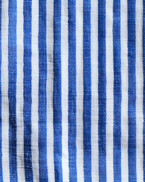A close-up of blue and white striped fabric