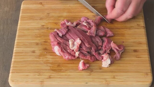 Learn how to slice meat tenderloin into small pieces for cooking and serving in your kitchen
