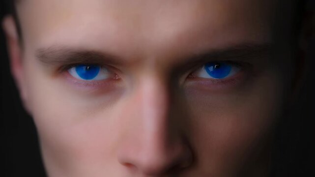 Close-up of a young man with striking blue eyes, conveying intensity and emotion. A powerful representation of human expression and connection