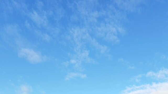 Cirrocumulus clouds moving in the sky early
