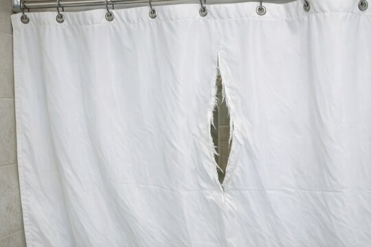 Shower curtain with a hole in it