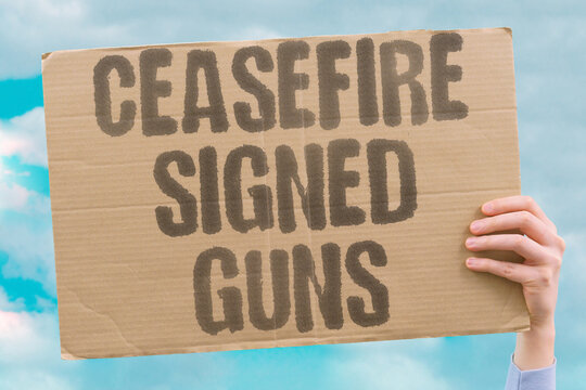 "Ceasefire signed guns" Truce agreement reached but weapons remain ready. READY. ALERT. STANDBY. TENSION. PREPARE.