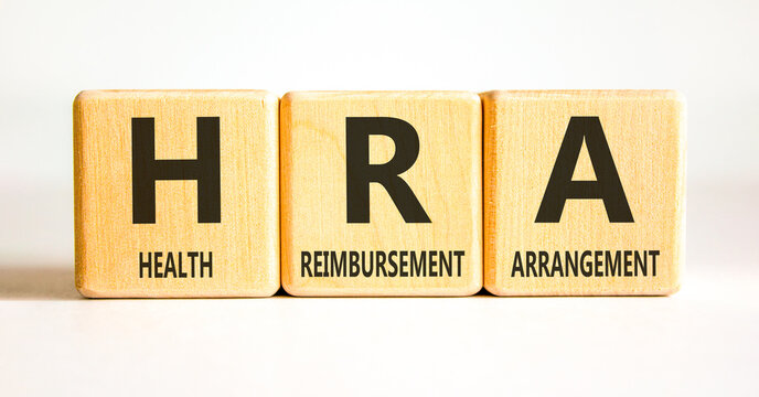HRA health reimbursement arrangement symbol. Concept words HRA health reimbursement arrangement on beautiful wooden blocks. Beautiful white background. Medical HRA concept. Copy space.