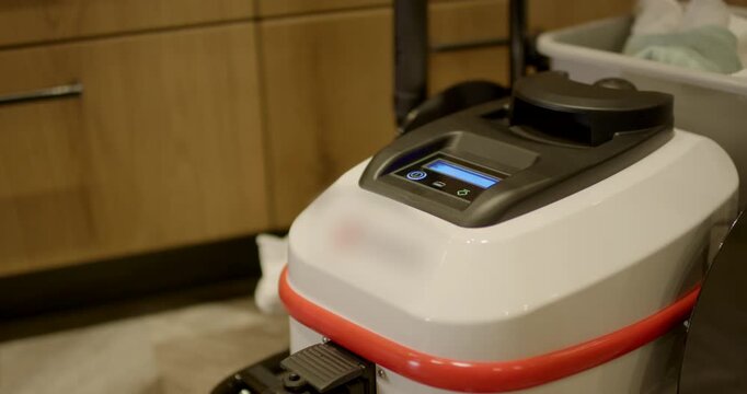 Close up view of professional high pressure steam machine device standing on a restaurant floor