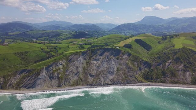 Rocky coastline and green cliffs aerial landscape. Flysch Begiratokia - Baratzazarrak. Deva, Gipuzkoa, Spain.