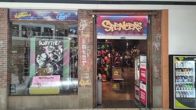 Washington, D.C., USA &ndash; March 3, 2025: The Spencer's store fa&ccedil;ade features an urban design with pop culture and street art elements. The open entrance reveals a densely packed retail space.