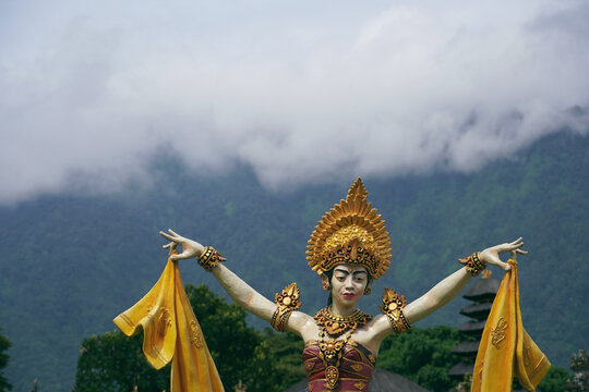 Traditional Balinese Dancer Statue with Mountain Backdrop at Bedugul Bali
