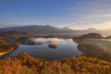 Colorful misty sunrise over the lake (Blejsko Jezero), the Assumption of Mary church and the castle, seen from Mala Osojnica hill. Bled-Slovenia-079