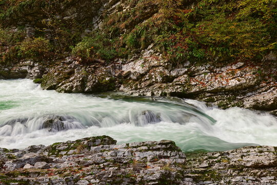 The Radovna river roaring green waters rush torrentially along the Soteska Vintgar (gorge), equipped with wood walkways and bridges. Bled-Slovenia-086