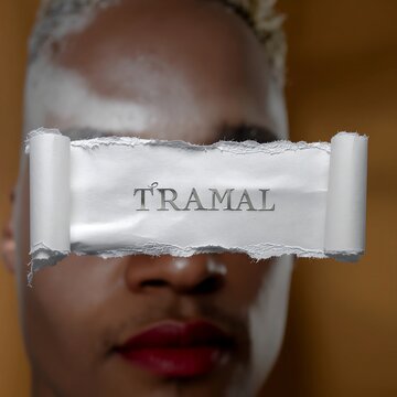 Close-up of Tramal pain relief medication box and capsules.