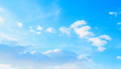 Obraz premium Pastel morning sky landscape, soft white clouds in the picturesque blue sky