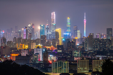 Obraz premium Panoramic night cityscape of Guangzhou CBD with lit high-rises and Canton Tower