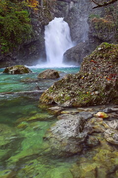 Slap Sum (Noisy Falls) on the Radovna river dropping 13 m into an emerald-green plunge pool, as it exits the Soteska Vintgar gorge. Bled-Slovenia-099