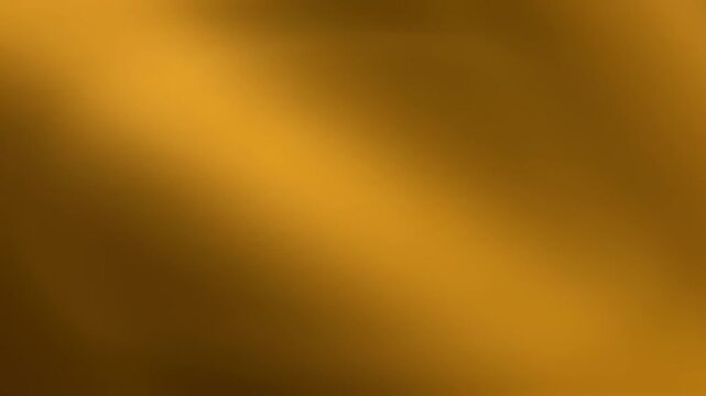 Abstract golden background with light rays and texture.