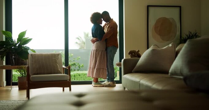 Couple, dance and love in lounge, house and bonding with partner on anniversary or smile on weekend. Black people, home and romance with spouse, rhythm and celebration for relationship milestone