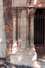 elements of architectural decorations of buildings, ancient arches and columns, pommel and patterns, on the streets in Barcelona, public places. © Kozlik_mozlik