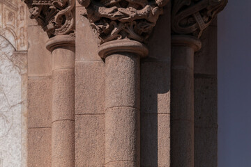 elements of architectural decorations of buildings, ancient arches and columns, pommel and patterns, on the streets in Barcelona, public places. © Kozlik_mozlik