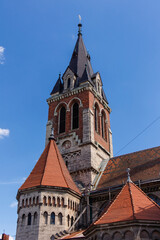 Fototapeta premium Located in Chortkiv, Ternopil region, St. Stanislaus Church impresses visitors with its Gothic Revival design, tall bell tower, decorative spires.