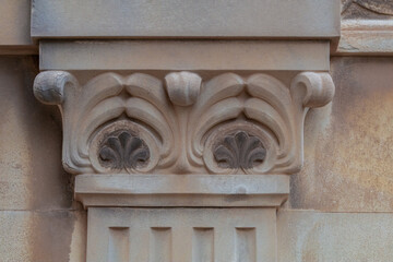 elements of architectural decorations of buildings, ancient arches and columns, pommel and patterns, on the streets in Barcelona, public places. © Kozlik_mozlik