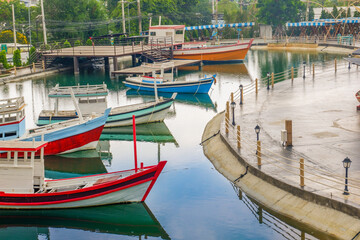Obraz premium Fisherman house and boats in a bay,fishermen village or market, amsterdam style with old houses and river,Tourists destination,travel concept.