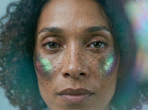 Woman with Shimmering Green and Purple Eye Makeup