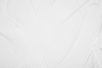 White textured wall surface with brush strokes © reddish