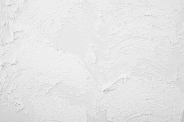 white textured wall surface with rough strokes © reddish