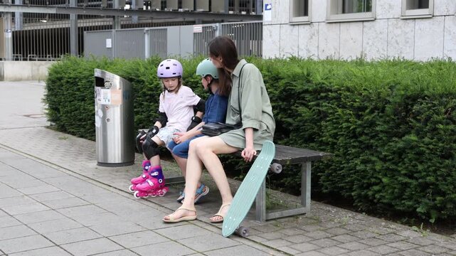 Children enjoy outdoor activities with roller skates and skateboard