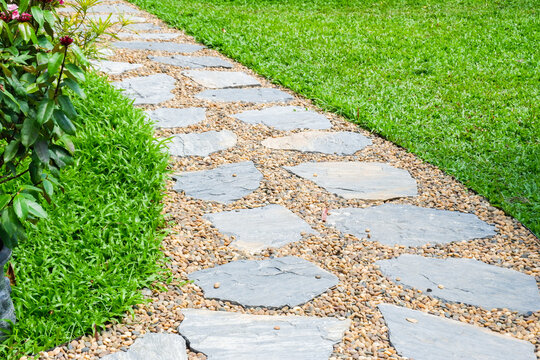 Garden landscape design with pathway in garden and footpath in picturesque summer park and staircase in backyard,Paving stones on floor in park,space for text.