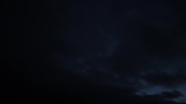 Dark clouds light up at sunrise