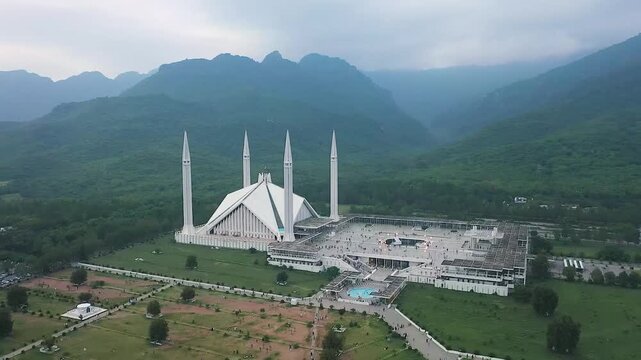 Panoramic Aerial View of Faisal Mosque Islamabad with Mountains and Urban Background