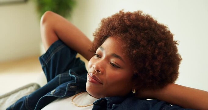Black woman, relax and calm in home with thinking, reflection or perspective on off day in living room. Female person, rest or break with vision, comfort and happy mindset with mindfulness at house