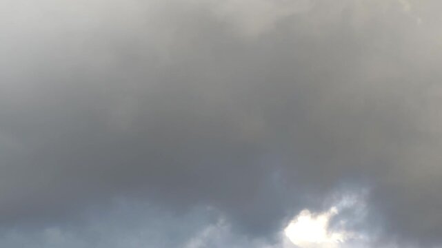 Golden stratocumulus moving in the sky at dawn