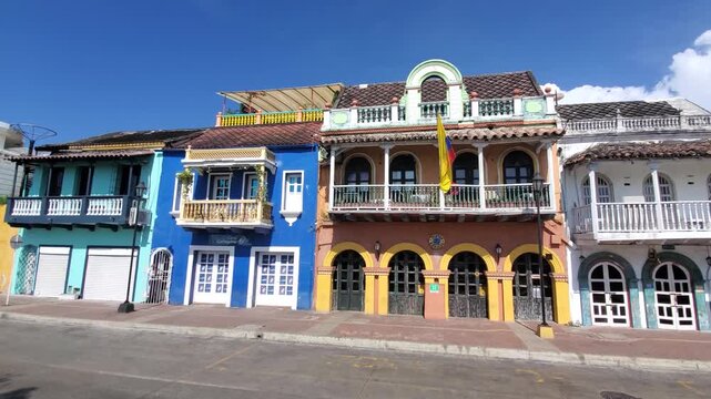 Cartagena, Bolivar, Colombia - 20 June 2026: View of colorful colonial architecture with vibrant facades and balconies along a quiet street in the Getsemani district.