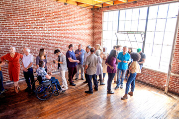 Diverse group socializing indoors photo