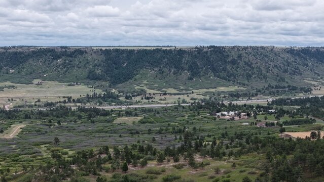 Serene view of mountain flats within Larkspur (Colorado) on a cloudy afternoon