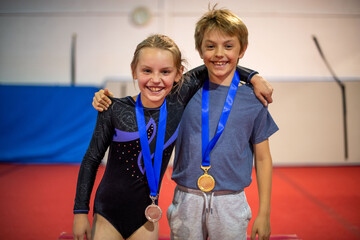 Fototapeta premium Young gymnasts celebrating victory together.