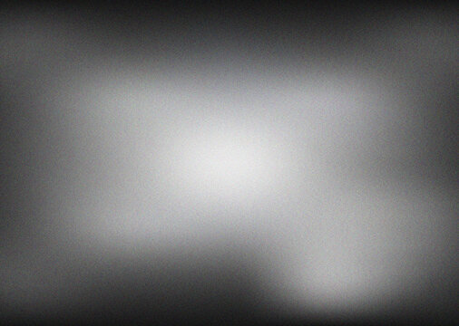 A dramatic dark grayscale gradient with intense central light and strong grainy texture creating a compelling abstract visual effect