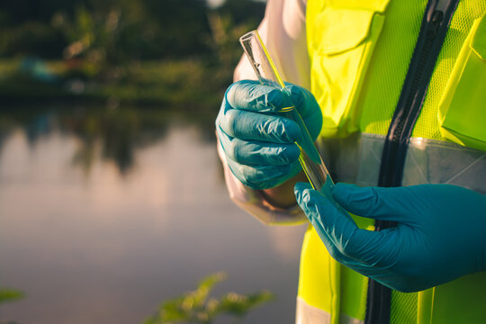 Water quality inspector collecting samples for testing and analysis to ensure safe and clean water resources.