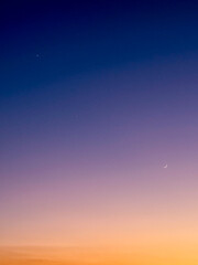 Venus, Jupiter, and Crescent Moon in Twilight Sky © Abdulkadir