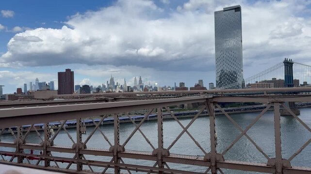 Motion of cars traffic on FDR drive. Panoramic, scenic view of Manhattan Skyline. Empire state building and Manhattan Bridge. View from the Brooklyn Bridge. New York City, United States